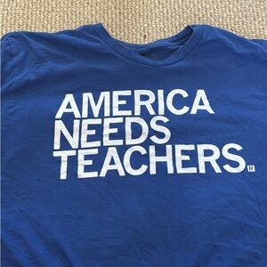Blue Short Sleeve Tee with 'America Needs Teachers' Slogan